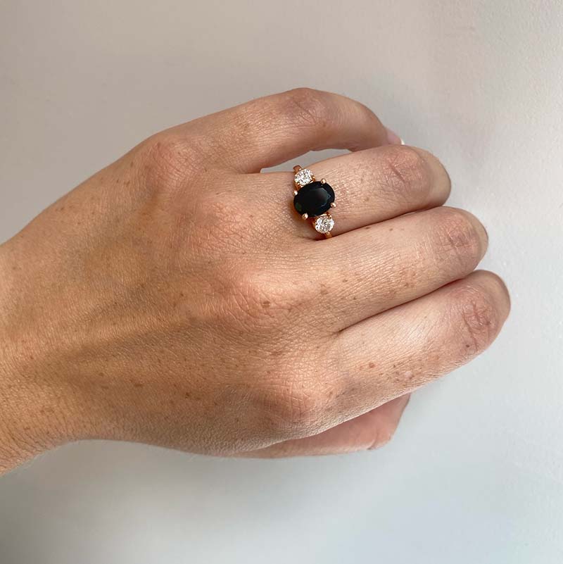 diamond ring on black hand