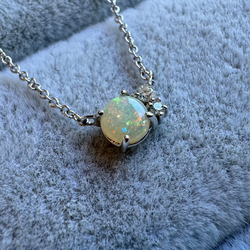 
                  
                    Load image into Gallery viewer, Each Amalthea necklace is adorned with one opal and two round cut diamonds. All settings and chain are 14 kt gold.
                  
                