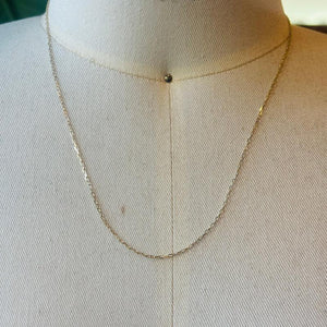 
                  
                    Load image into Gallery viewer, This 14 kt solid yellow gold chain is shown on an off white bust for scale.
                  
                