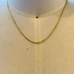 This 14 kt solid yellow gold chain on a display bust.