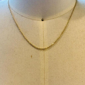 
                  
                    Load image into Gallery viewer, This 14 kt solid yellow gold chain on a display bust.
                  
                