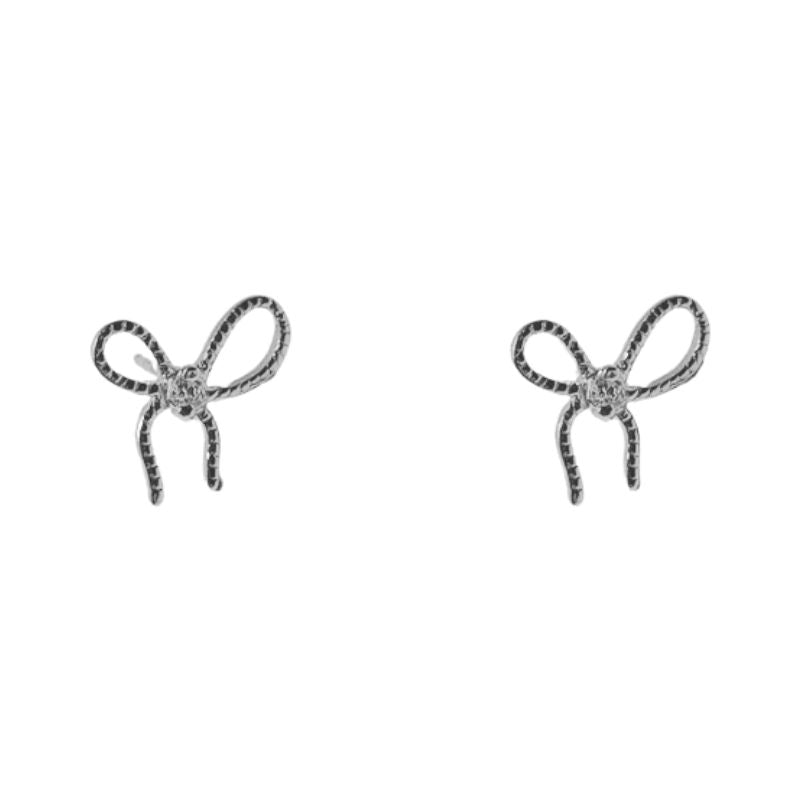 Solid sterling silver thin bow shaped earrings with a singular crystal in the middle.