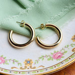 These 14kt yellow gold hoops are timeless treasures, glowing with a warm golden hue that catches the light like sunlight on a serene morning. With a hollow design, these beautiful hoops are very light wear, great for all day, everyday.