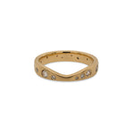 This 14 kt gold shadow band is adorned with 23 round cut white diamonds. The unique curvature of this ring allows it to rest perfectly against several of our gemstone rings. A beautiful complement to an engagement ring, yet looks amazing when worn by itself as well.