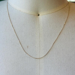 
                  
                    Load image into Gallery viewer, This 14 kt solid yellow gold chain is shown on an off white bust.
                  
                