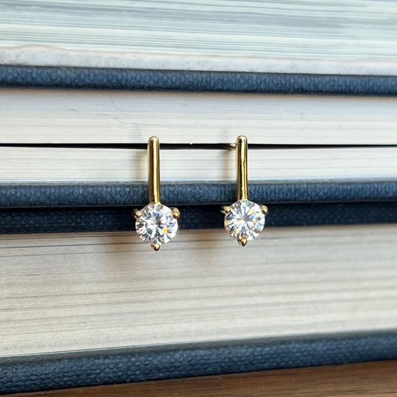 These drop studs are made of 14 kt gold vermeil, and genuine crystals.