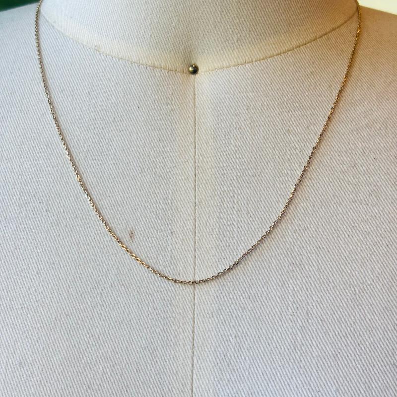 This 14 kt solid yellow gold chain is adjustable 16