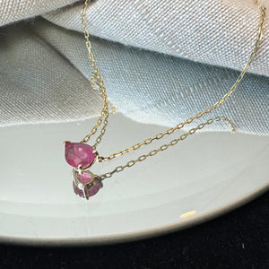 
                  
                    Load image into Gallery viewer, Set in a V-end single base setting, this pear cut pink sapphire necklace is a favorite of ours for everyday wear.
                  
                