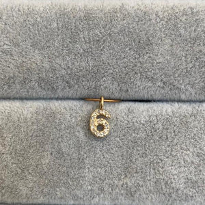 
                  
                    Load image into Gallery viewer, A perfect charm to add onto any chain or bracelet. Cast in 14kt yellow gold adorned with 11 round cut diamonds. Shown on gray background
                  
                