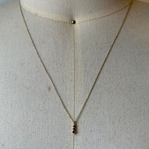 
                  
                    Load image into Gallery viewer, Petite ruby necklace shown on bust for scale.
                  
                