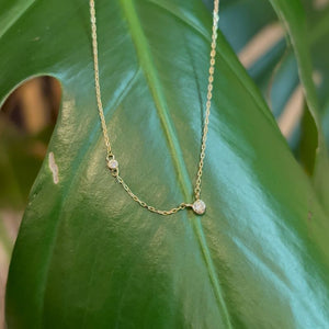 
                  
                    Load image into Gallery viewer, Diamond necklace against a green leaf showing 2 of the 3 diamonds.
                  
                