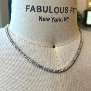 
                  
                    Load image into Gallery viewer, The  crystal tennis necklace is available in sterling silver and secured with a box-clasp closure. An affordable and stylish option for all occasions.
                  
                