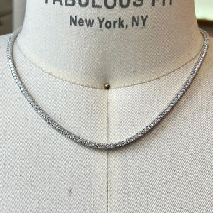 
                  
                    Load image into Gallery viewer, The  crystal tennis necklace is available in sterling silver and secured with a box-clasp closure. An affordable and stylish option for all occasions.
                  
                