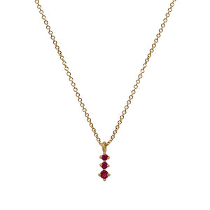 
                  
                    Load image into Gallery viewer, A dainty 14 kt yellow gold necklace with a pendant that has 3 small, round cut rubies in a north south setting on a white background.
                  
                