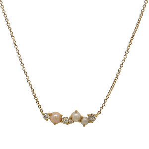 
                  
                    Load image into Gallery viewer, Front view of a cluster bar style necklace with 3 pearls in varied sizes and 4 round diamonds in varying sizes in 14k yellow gold.
                  
                