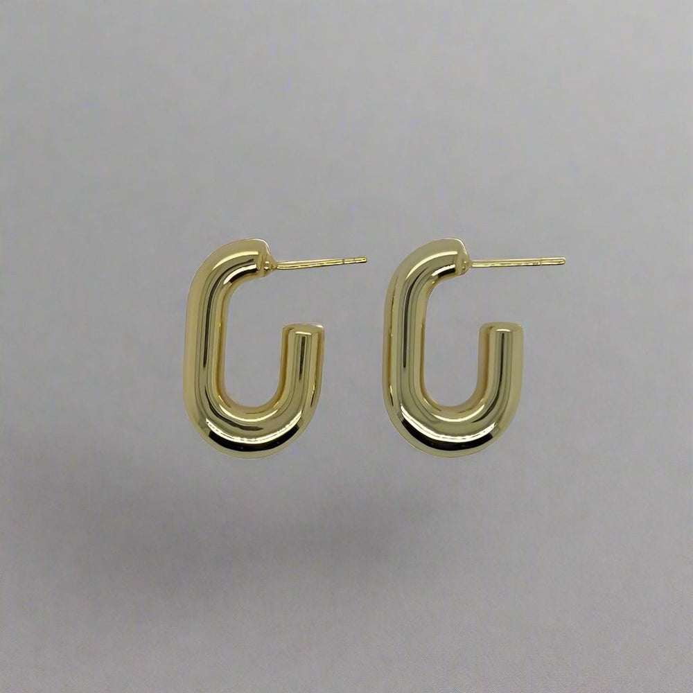 Made of 925 sterling silver with 14kt yellow gold vermeil plating. These drop hoop style earrings have a post back and are the perfect statement piece to add to any outfit.